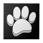 White Dog Pawprint Hand Drawn Custom Ceramic Tile<br><div class="desc">Cartoon dog pawprint in white on black background. Faux 3D effect applied to the image.
Decorative tiles for homes and businesses like pet shops.
Gift idea for dog lovers.</div>