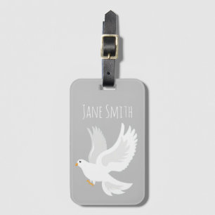 White dove bird on grey luggage tag