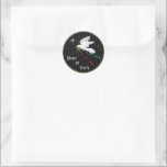 White Dove Classic Round Sticker<br><div class="desc">This Beautiful "One of a Kind" Christmas Sticker... features a serene White Dove flying among the stars carrying an Olive Branch with flowing Red & Green Ribbons... ..Spreading "Peace On Earth"!

This is an Original Art Design By Artist Kerry Miller.</div>