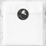 White Dove Classic Round Sticker<br><div class="desc">This Beautiful "One of a Kind" Christmas Sticker... features a serene White Dove flying among the stars carrying an Olive Branch with flowing Red & Green Ribbons... ..Spreading "Peace On Earth"!

This is an Original Art Design By Artist Kerry Miller.</div>