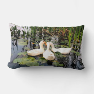 White ducks, lily pads, cattails, lake shore lumbar cushion