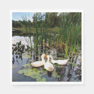 White ducks, lily pads, cattails, lake shore napkin