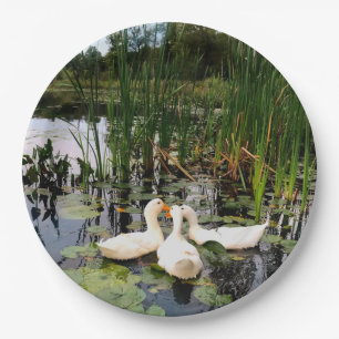 White ducks, lily pads, cattails, lake shore paper plate