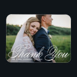 White Elegant Photo Wedding Thank You Magnet<br><div class="desc">Celebrate your love and show gratitude with our customisable photo wedding thank you magnet! This unique keepsake is perfect for reminding your loved ones of your special day while expressing your heartfelt thanks in a memorable way. It features an elegant calligraphy and classic typography. You can personalise this elegant wedding...</div>