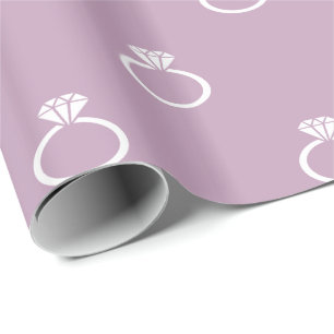 White Engagement Rings on Mauve Mist Purple Wrapping Paper