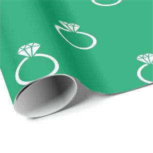 White Engagement Rings on Shamrock Green Wrapping Paper