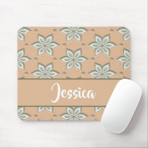 White engraved flowers on tan mouse pad