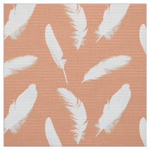 White feather print on soft peach fabric