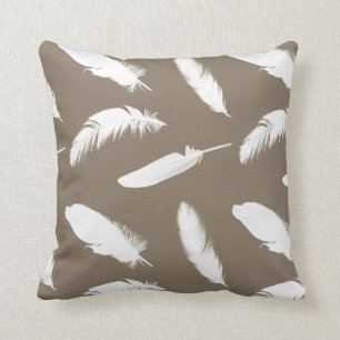 White feather print on taupe cushion