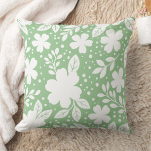 White Floral Design on a Soft Green Background Cushion
