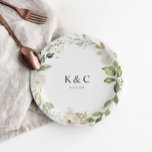 White Floral Greenery Wedding Bridal Shower Paper Plate<br><div class="desc">Bridal shower plates or dessert plates for weddings or engagement parties: Add a touch of elegance to your wedding desserts,  bridal shower,  or engagement party with these personalised paper plates. Featuring a chic greenery and white floral design with customisable initials and date,  they’re perfect for celebrating in style!</div>