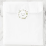 White Floral Greenery Wedding Classic Round Sticker<br><div class="desc">Elevate your wedding stationery with our White Floral and Greenery Wedding Envelope or Favour Sticker. This exquisite sticker showcases a delicate arrangement of white florals and lush greenery, adding a touch of elegance and natural beauty to your invitations, envelopes, or favour packaging. Designed with meticulous attention to detail, the sticker...</div>