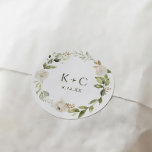 White Floral Greenery Wedding Classic Round Sticker<br><div class="desc">Elevate your wedding stationery with our White Floral and Greenery Wedding Envelope or Favour Sticker. This exquisite sticker showcases a delicate arrangement of white florals and lush greenery, adding a touch of elegance and natural beauty to your invitations, envelopes, or favour packaging. Designed with meticulous attention to detail, the sticker...</div>