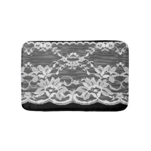 White floral lace: black background. bath mat