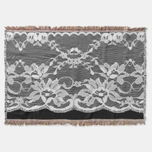 White floral lace: black background. throw blanket