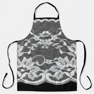 White floral lace on a black background. apron