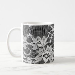 White floral lace on a black background. coffee mug