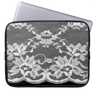 White floral lace on a black background. laptop sleeve