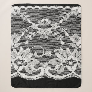 White floral lace on a black background. sherpa blanket