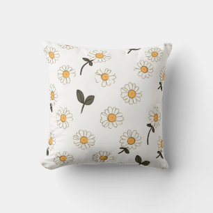 white floral pillow with yellow centre