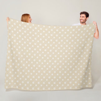 White floral print on tan fleece blanket