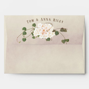 white flower and ivy bouquet with name envelope