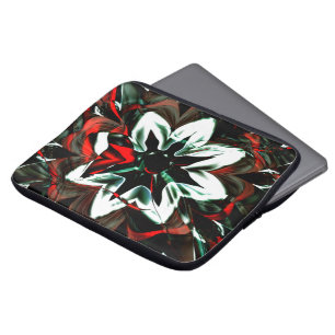 White flower surrounded by dark tones and glossy   laptop sleeve