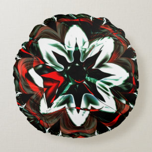 White flower surrounded by dark tones and glossy round cushion