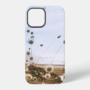 WHITE FLOWERS FIELD NEAR BODY OF WATER UNDER BLUE iPhone 12 CASE