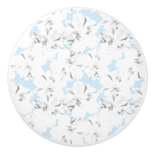 White flowers on light blue. ceramic knob