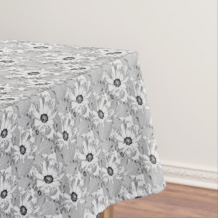 White flowers on light gray. tablecloth