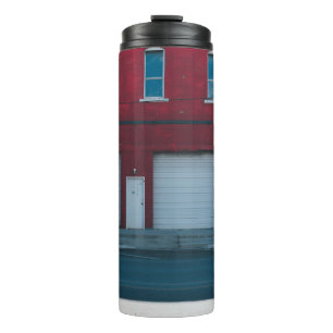 WHITE GARAGE DOORS CLOSED DURING DAYTIME THERMAL TUMBLER