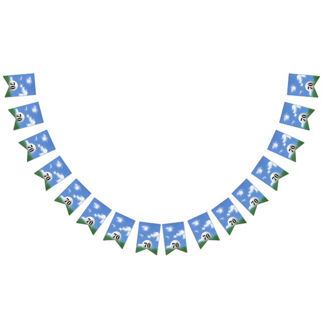 white golf ball in grass for 70th birthday party bunting  (All)