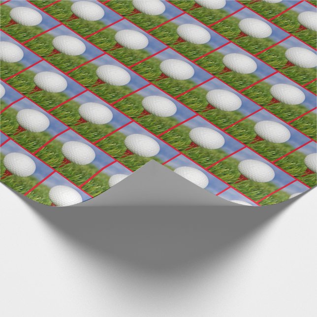 white golf ball on red tee wrapping paper (Corner)