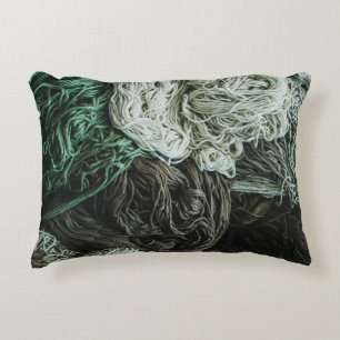 White, gray, and green ropes decorative cushion