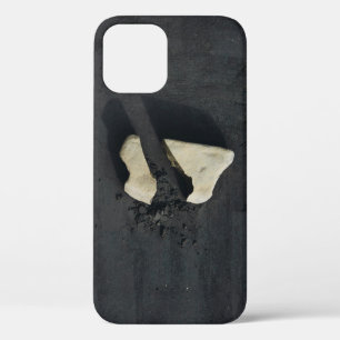 White heart shaped on black surface iPhone 12 case