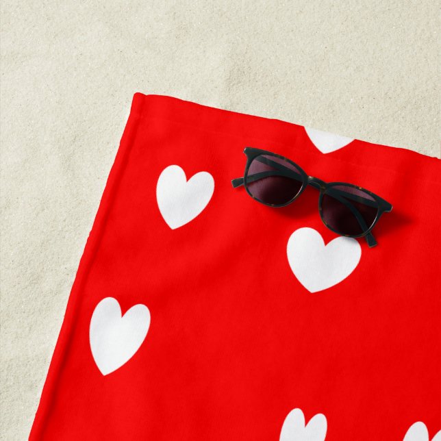 White hearts pattern on red beach towel (In Situ)