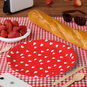 White hearts pattern on red paper plate