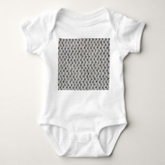 White knitted wool texture, close-up photo. baby bodysuit