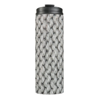 White knitted wool texture, close-up photo. thermal tumbler