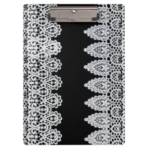White lace forms a delicate border against black clipboard