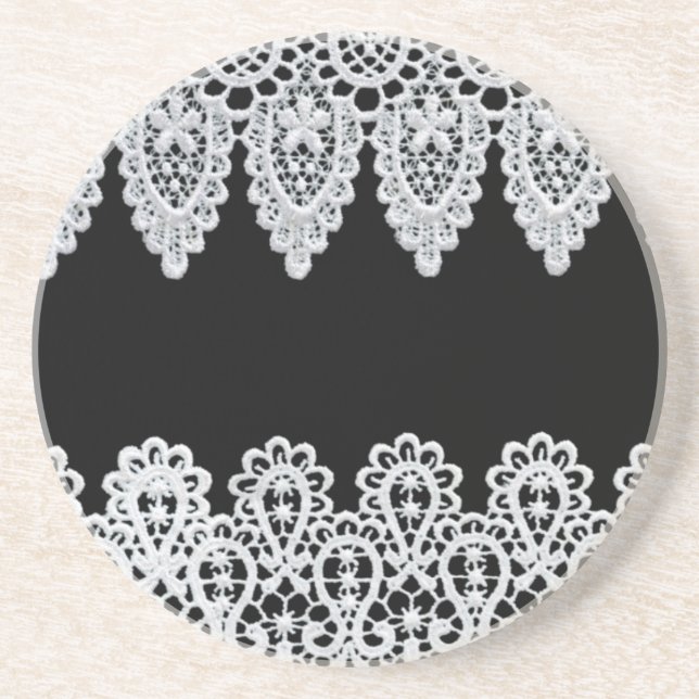 White lace forms a delicate border against black coaster (Front)