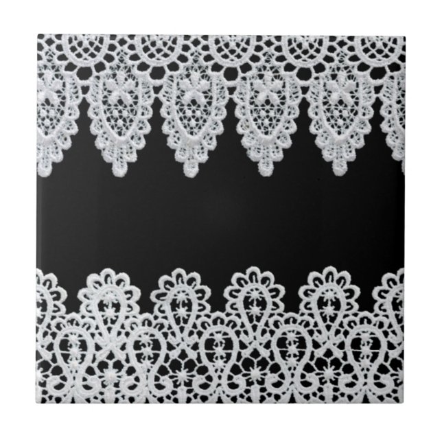 White lace forms a delicate border against black tile (Front)