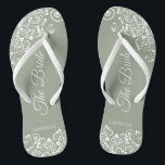 White Lace on Sage Green The Bride Elegant Wedding Thongs<br><div class="desc">Dance the night away with these beautiful wedding flip flops. Designed for the bride, they feature a simple yet elegant design with fancy script lettering on a sage green background and white lace curls and swirls. Beautiful way to stay fancy and appropriate while giving your feet a break after a...</div>