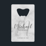 White Marble Modern Script Personalised Groomsmen<br><div class="desc">Add a personal touch to your wedding with personalised groomsmen credit card bottle opener. This bottle opener features personalised groomsmen's name in grey modern script font style and monogram in light grey modern script font style as background with title and wedding date in grey modern sans serif font style on...</div>