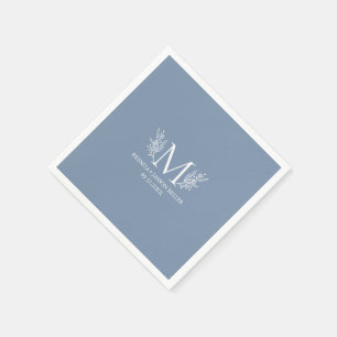 White monogram botanical flower on blue-grey napkin