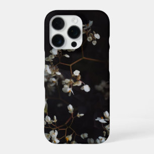 White moody flowers on dark background iPhone 16 pro case