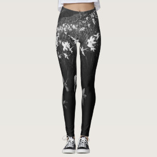 White narcissus flowers in darkness leggings