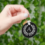 White On Black Laurel Wreath With Custom Monogram Key Ring<br><div class="desc">Destei's lovely circle shaped laurel wreath with a personalizable monogram initial inside of it. The color scheme is white on black.</div>