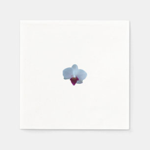 White orchid with purple on a napkin